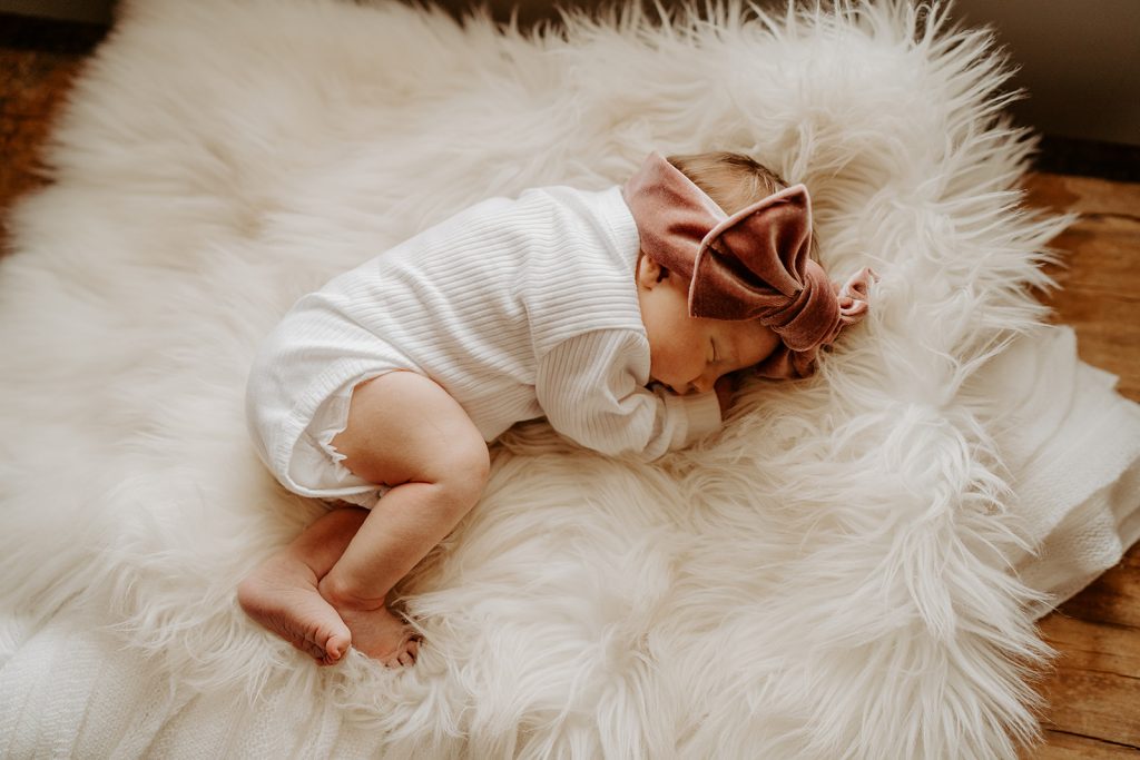 baby newborn session with cute fur blanket