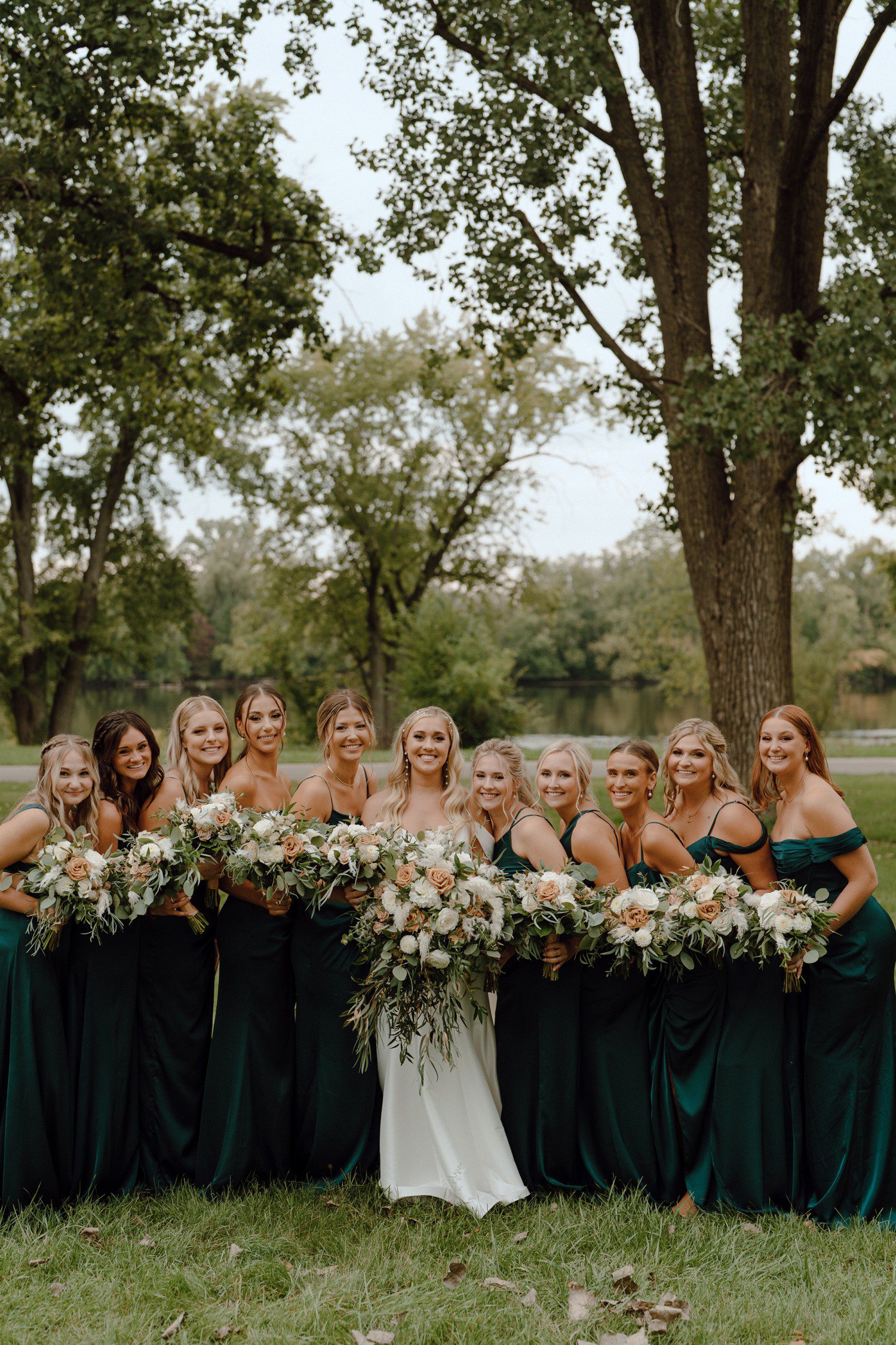 Bride and bridesmaid photos with dark green bridesmaid dresses.