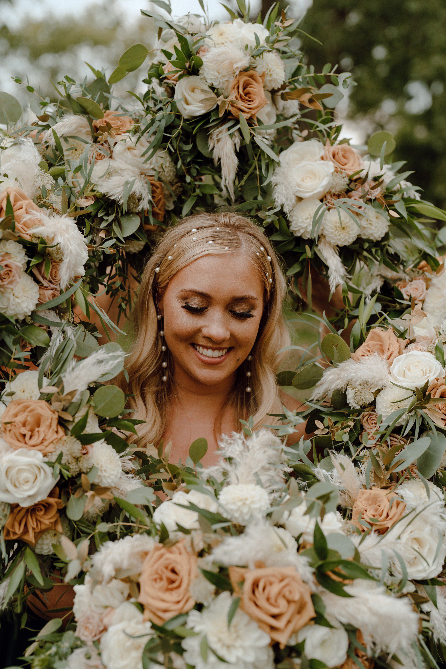 Bridal portraits with flowers framing brides face.