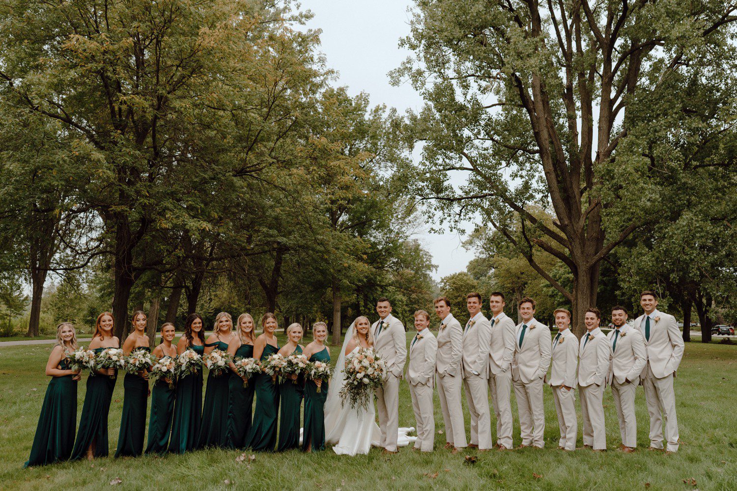 Wedding party photos with bridesmaids in dark green dresses and groomsmen in khaki.