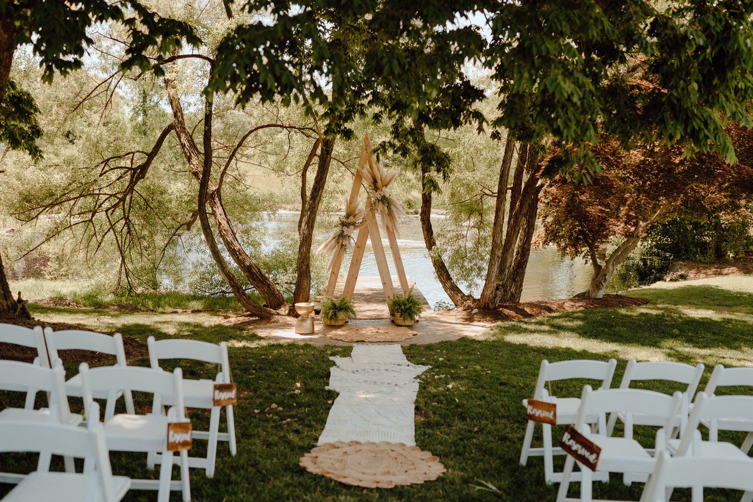 Wedding Ceremony Triangle Arch with rugs