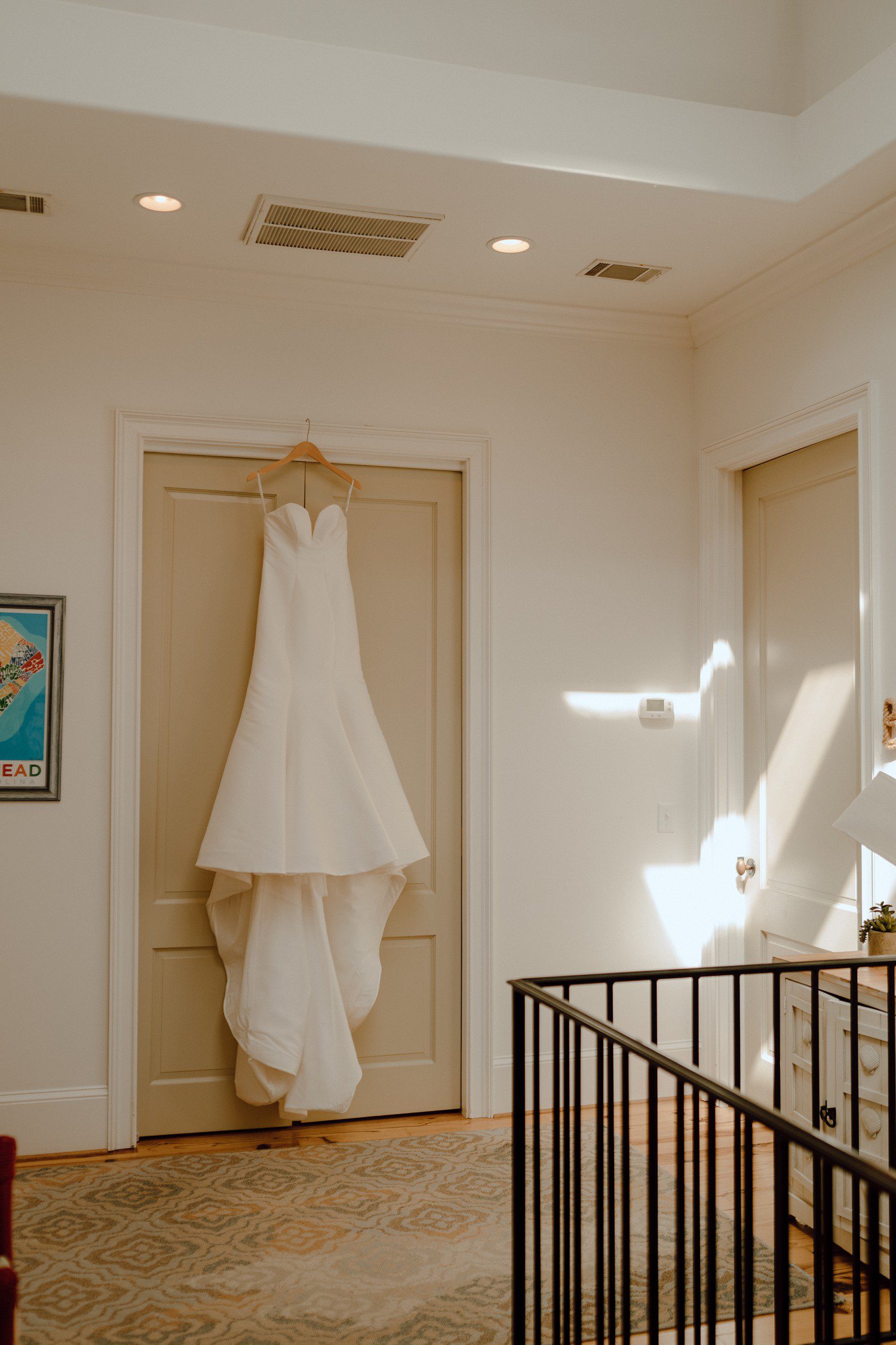Wedding dress hanging in airbnb