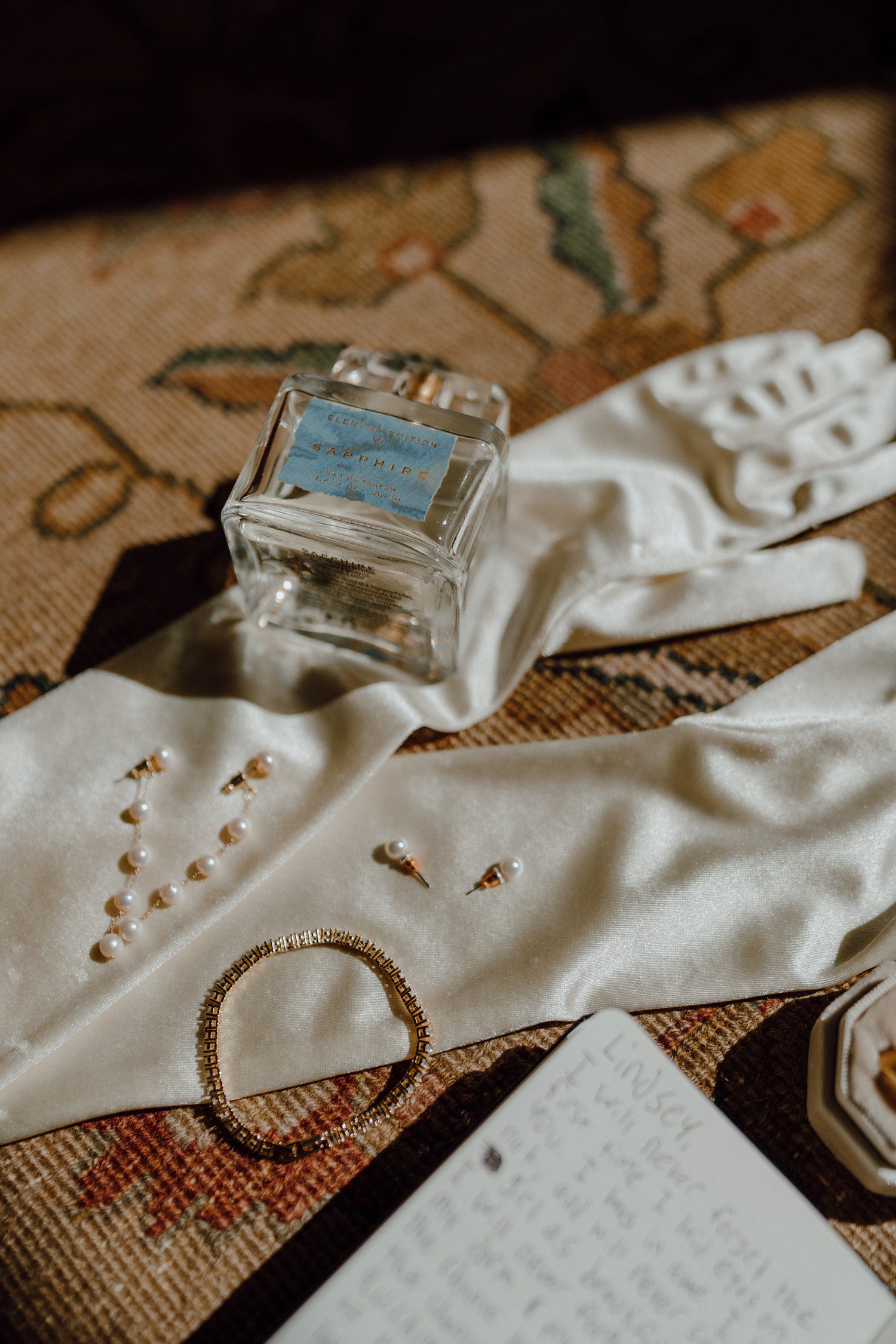 Bridal wedding details with gloves and jewelry