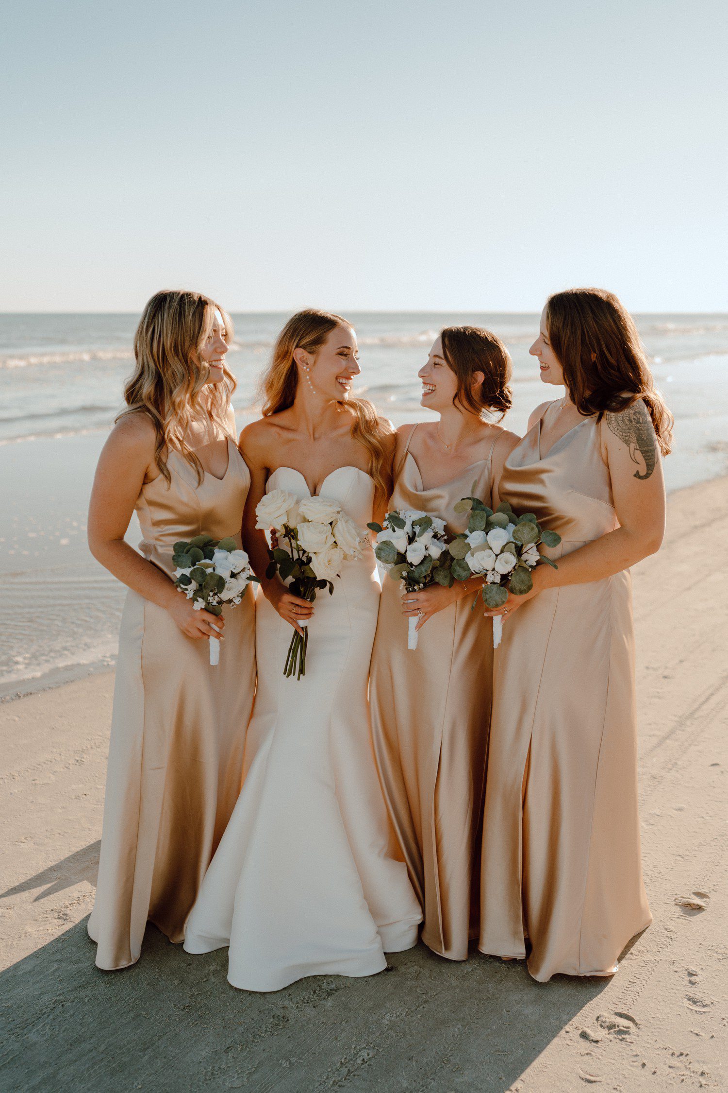 Bridesmaids in champagne dresses for beach wedding 