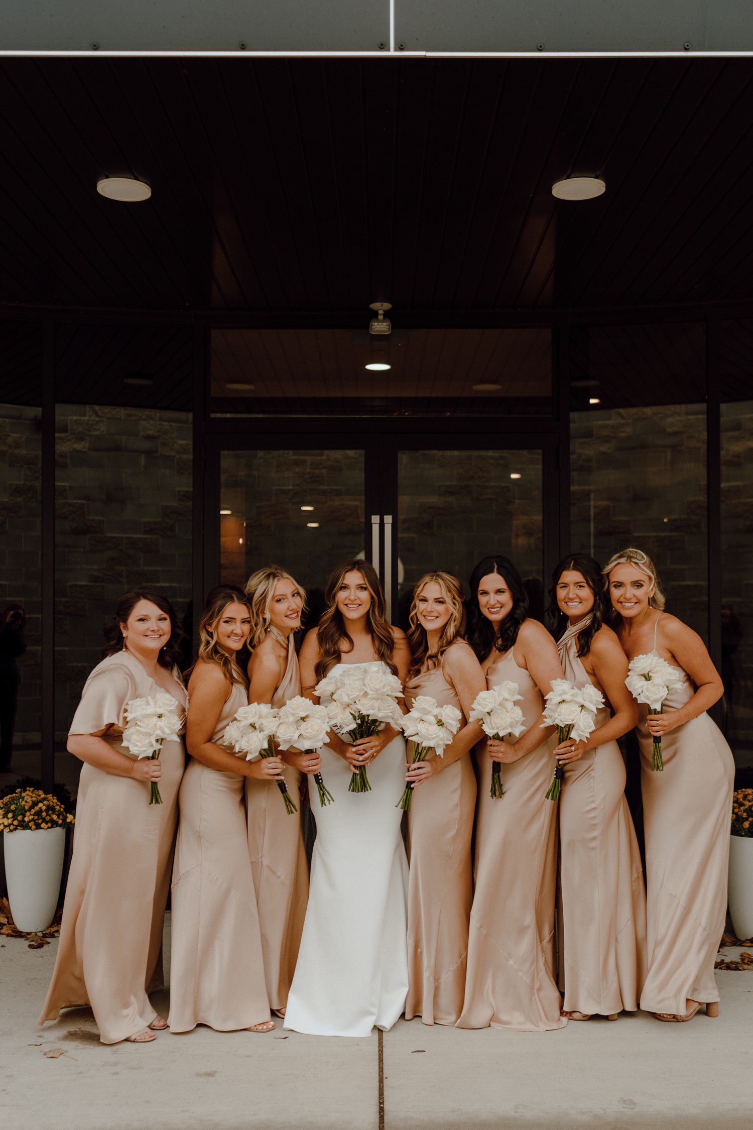 Bride and Bridesmaids in champagne color dresses for Michigan wedding. 