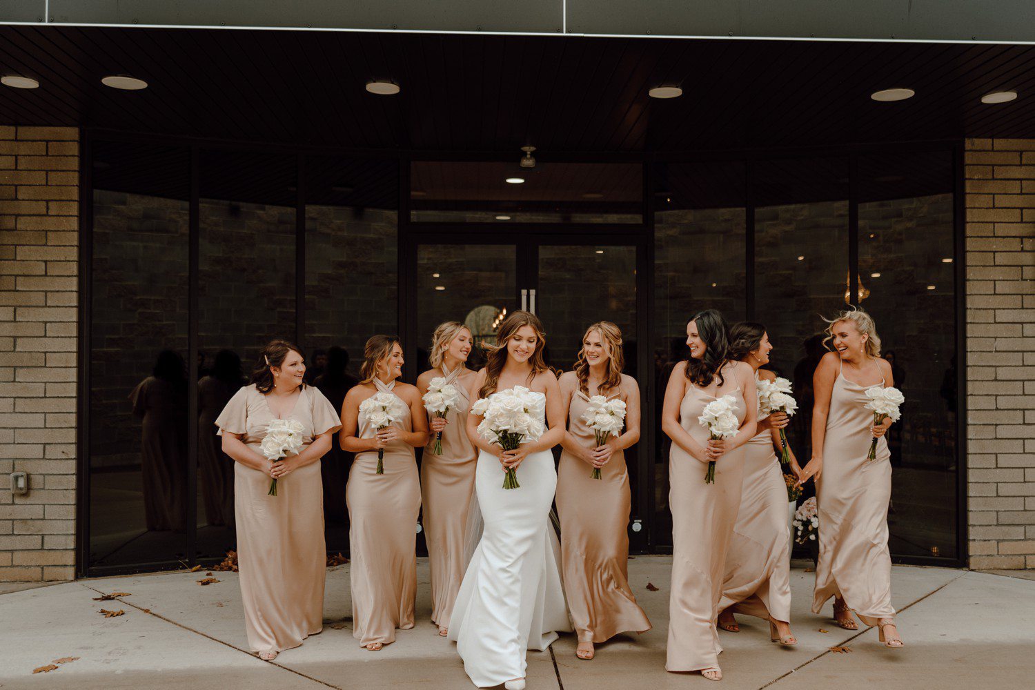 Bride and Bridesmaids in champagne color dresses at Port 393. 