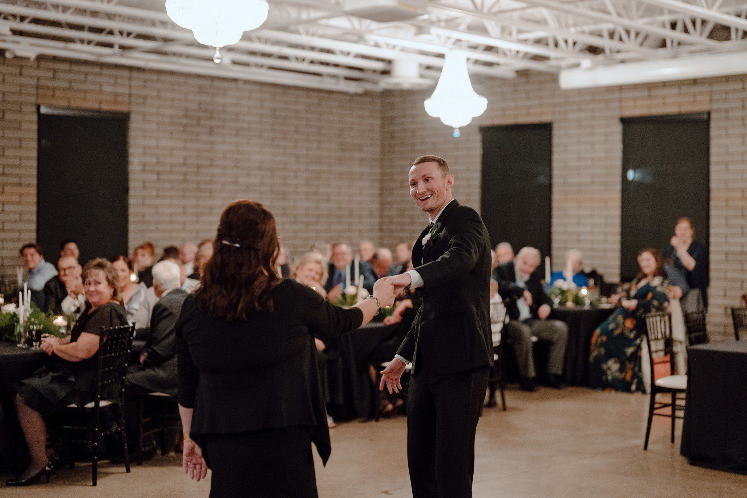 Groom dancing with mom for first dance at wedding reception