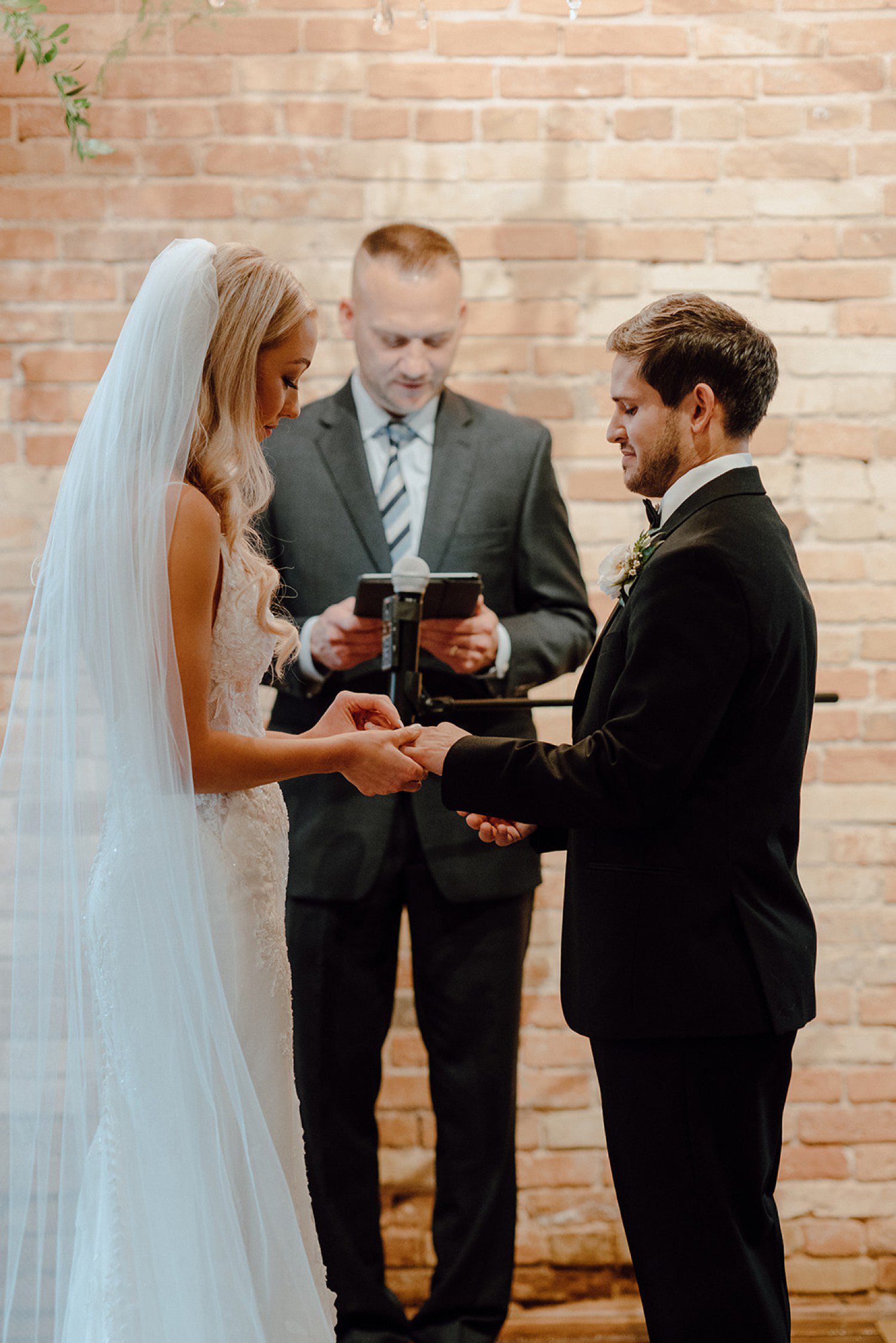 Wedding ring exchange during ceremony 