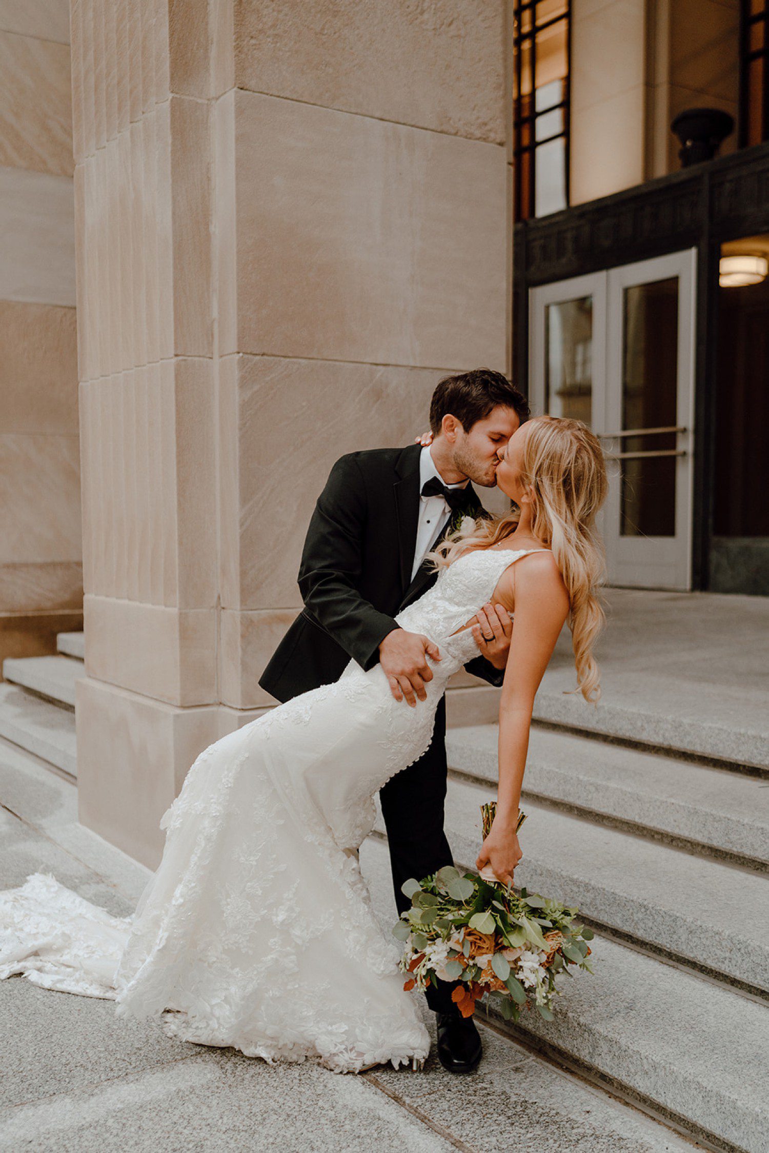 Grand Rapids wedding photos with bride and groom dip kiss 