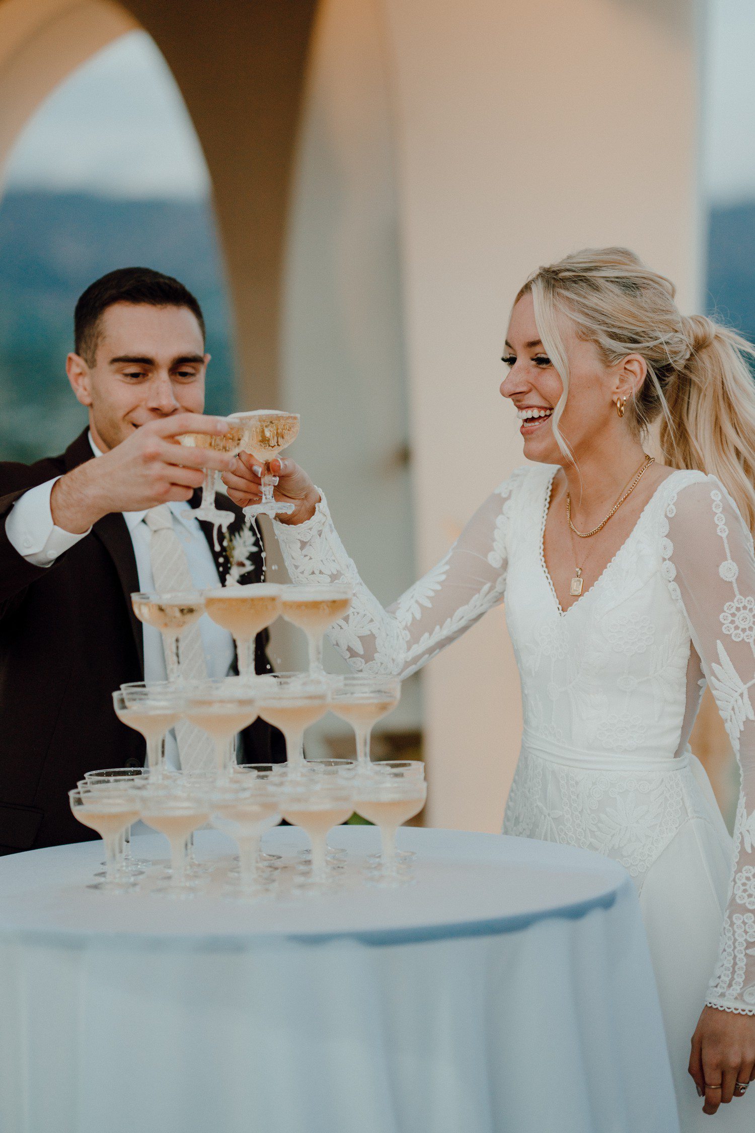 Champagne tower pour for wedding reception in Santa Barbara. 