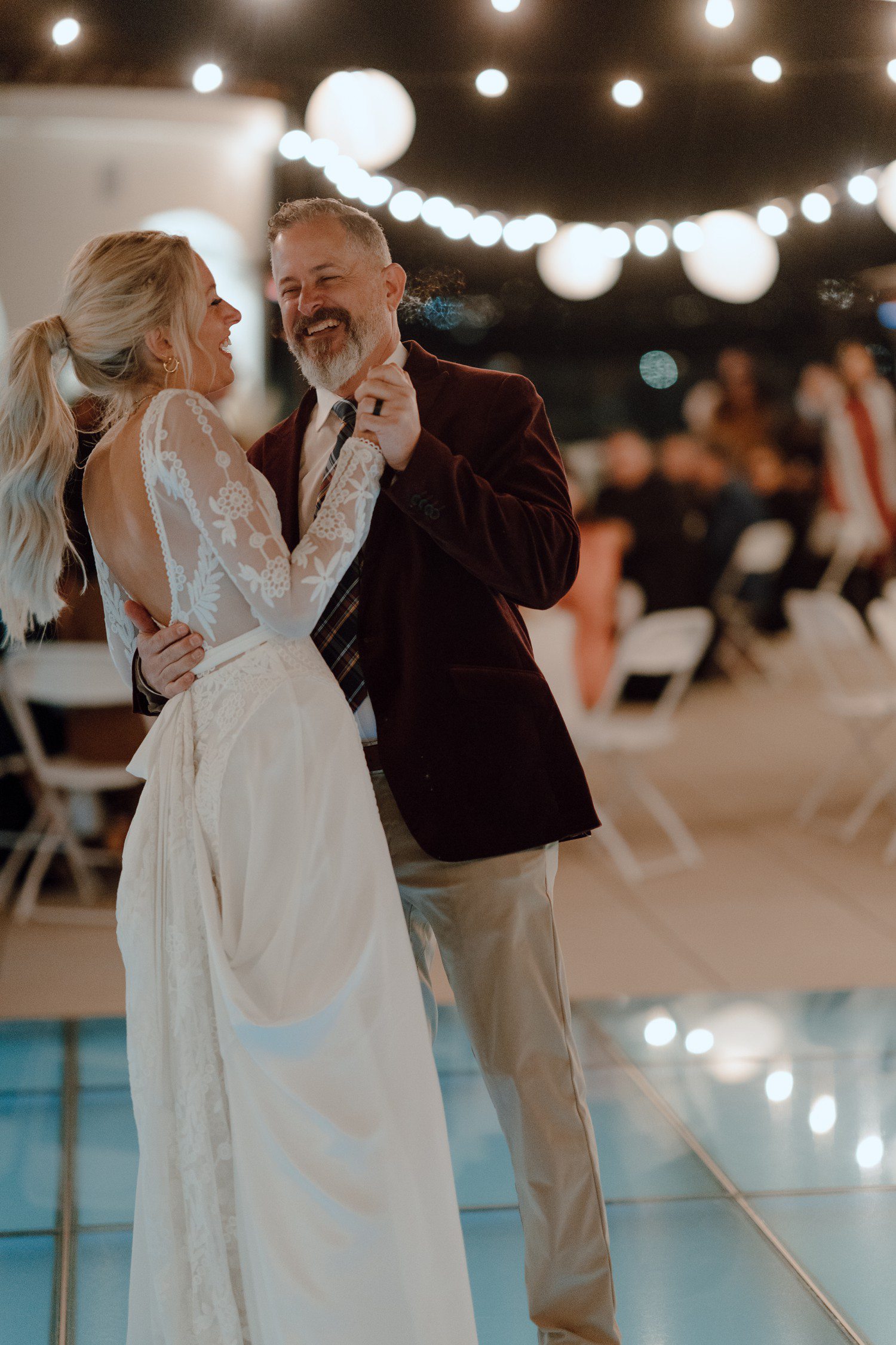 Bride and father first dance during wedding reception at Moxi Museum. 