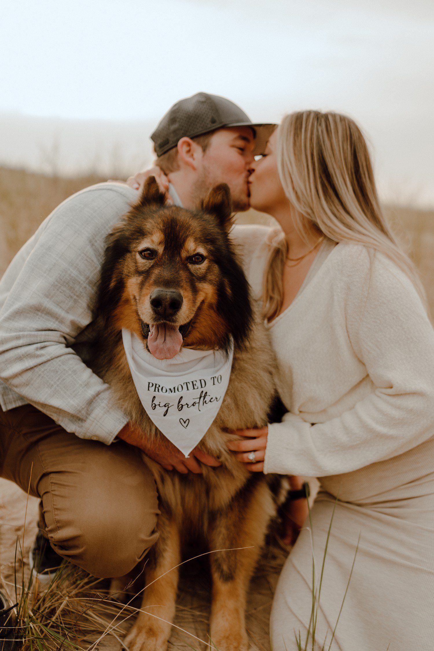 Grand Haven Beach Pregnancy Announcement photos with dog