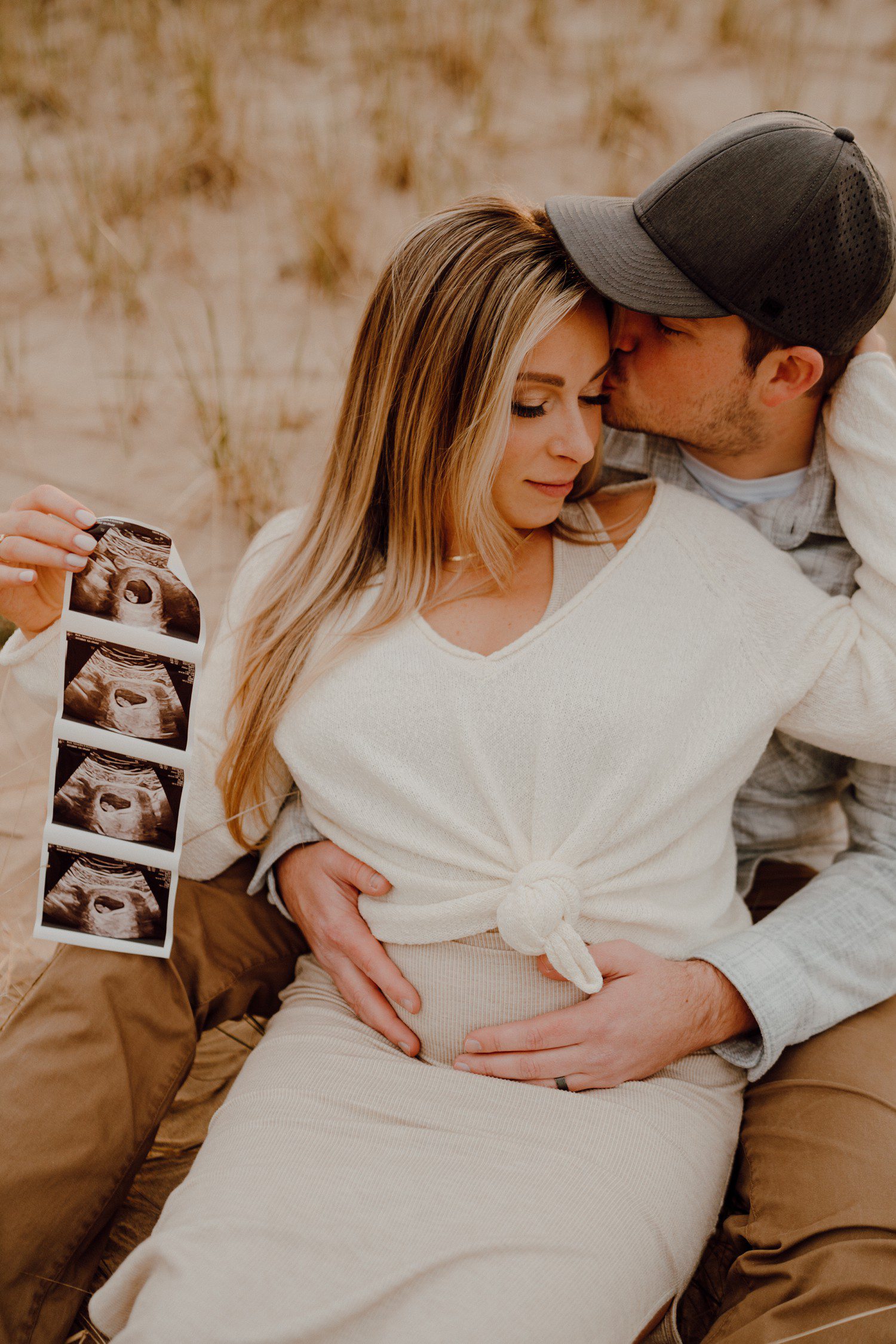 Pregnancy announcement photos with sonogram. 