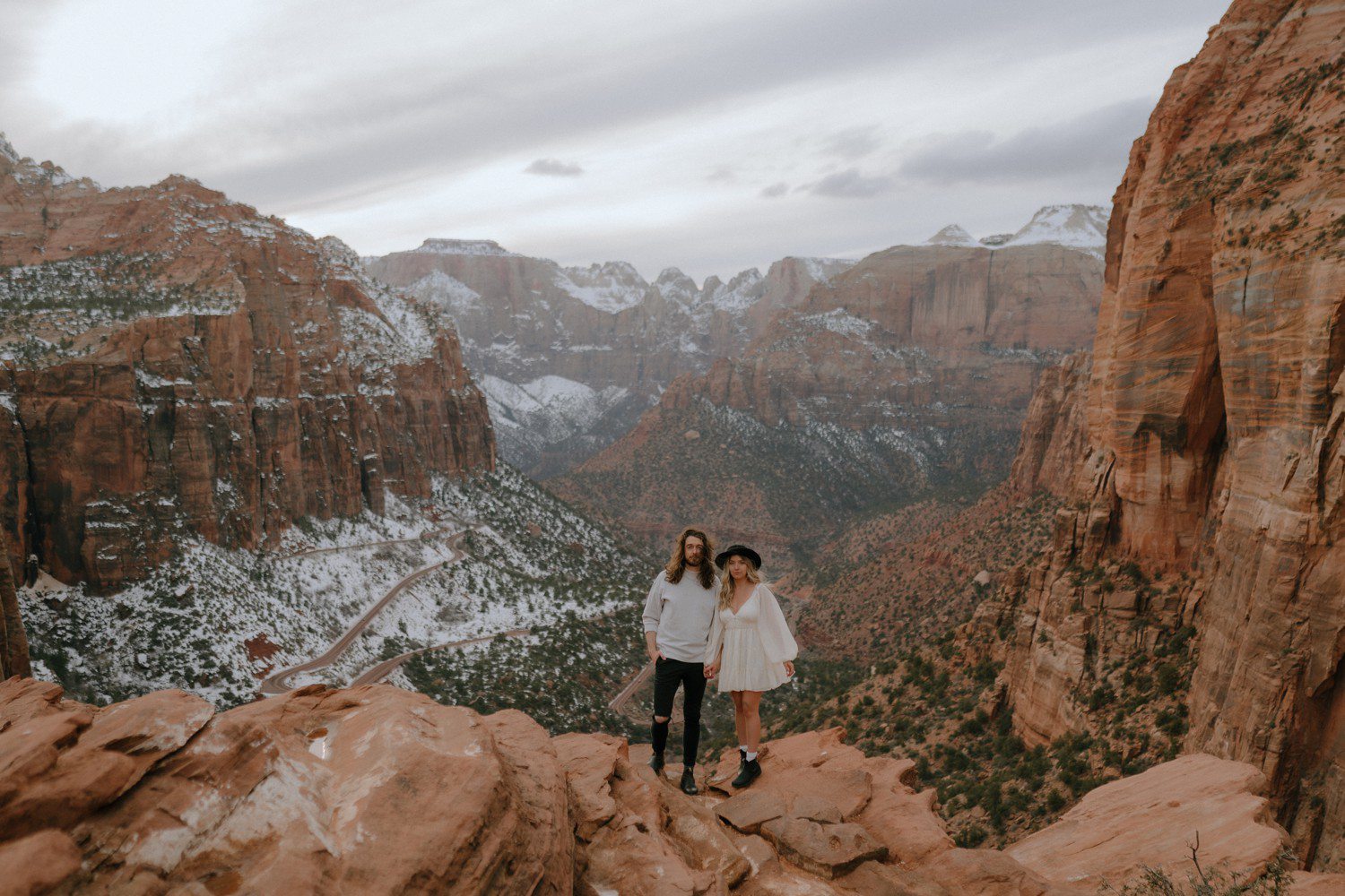 Photos of couple at canyon overlook in Zion National Park 