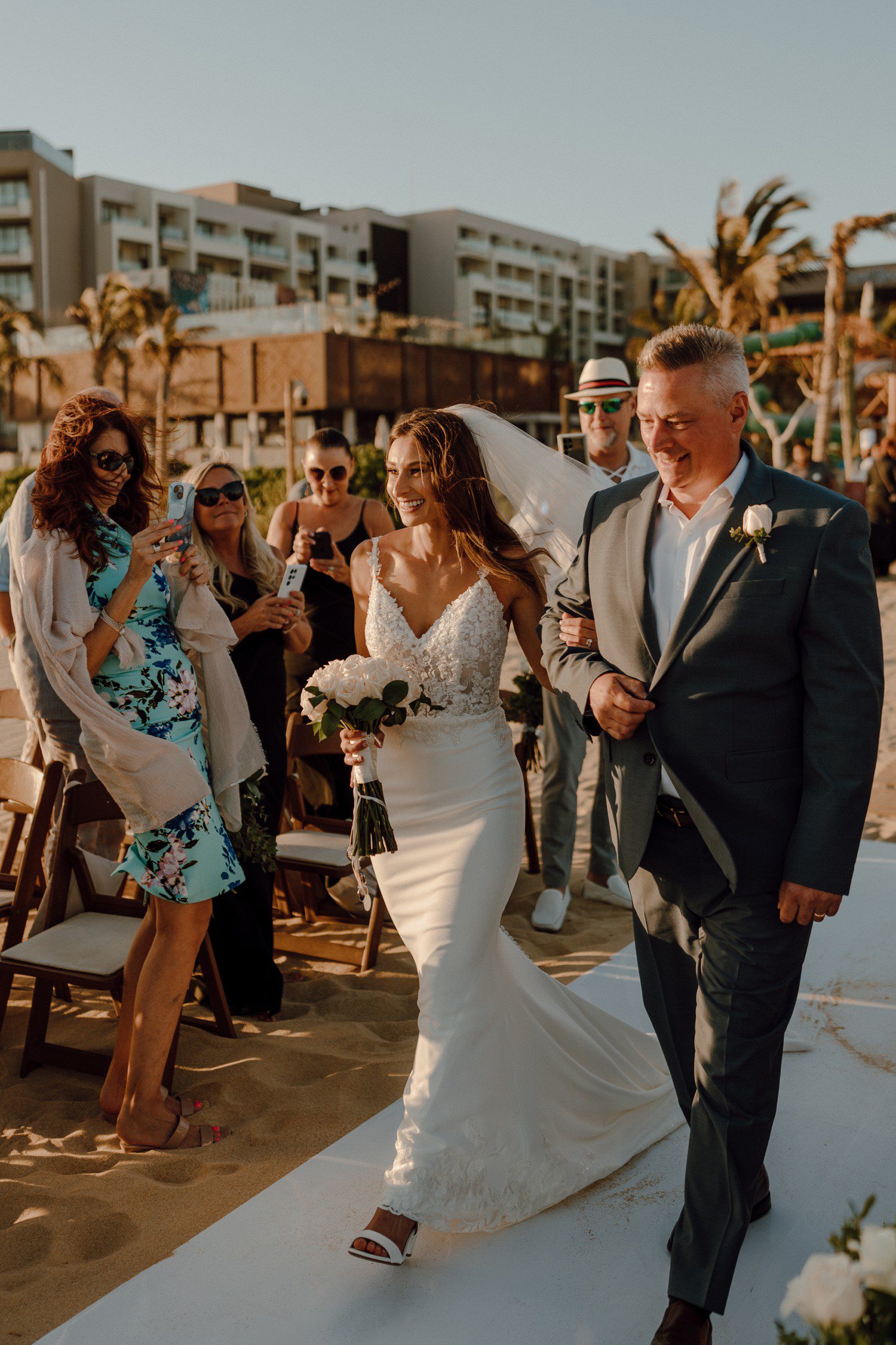 Bride and dad walking down aisle for destination wedding in Los Cabos. 