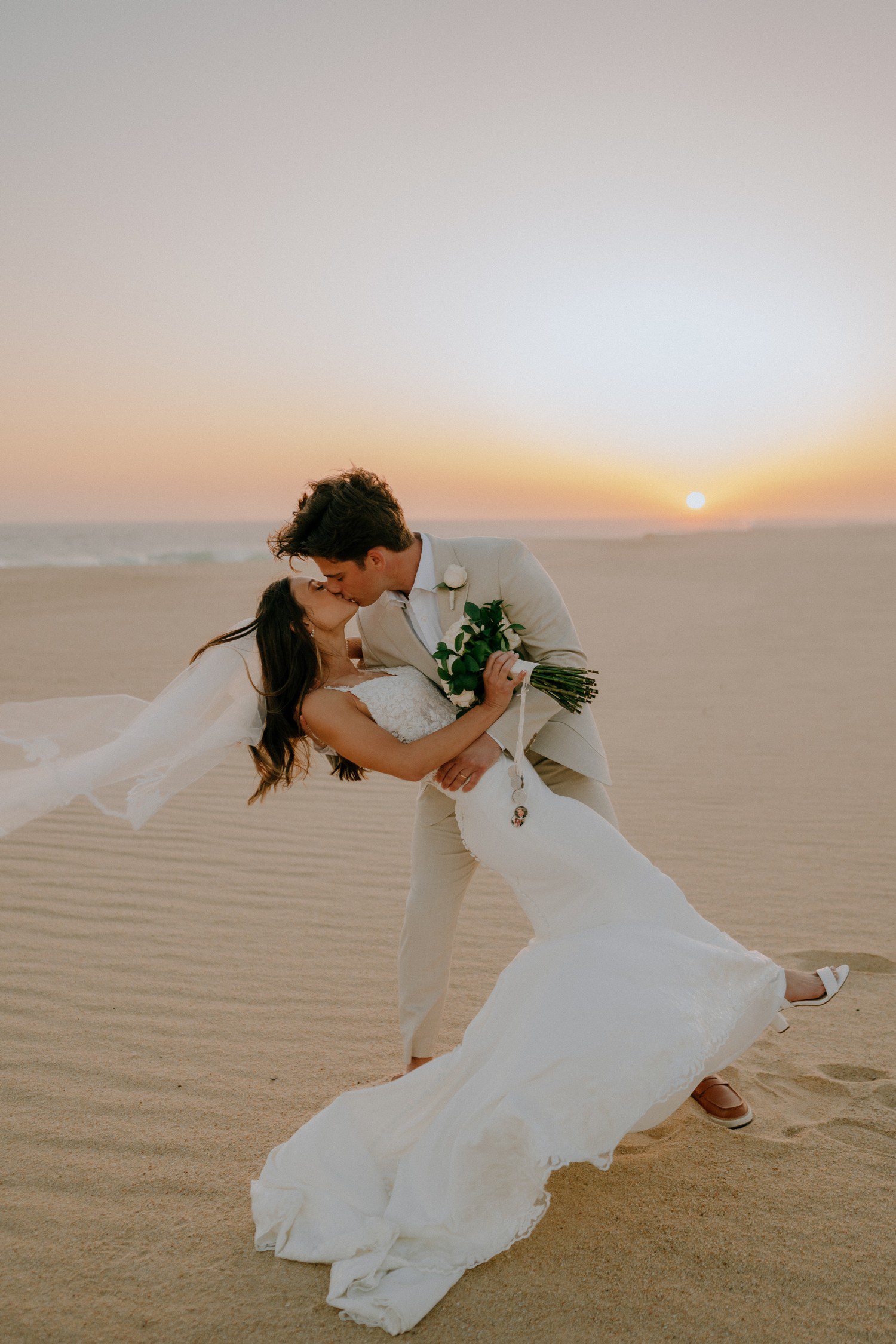 Los Cabos beach wedding photos during sunset.