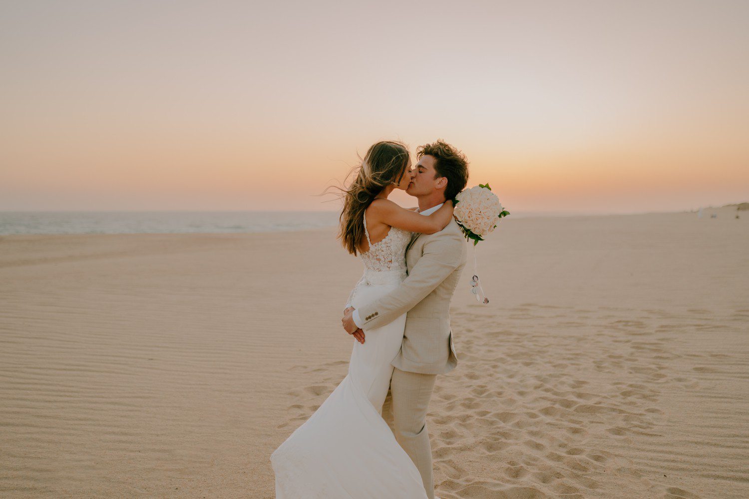 Beach wedding photos in Los Cabos at Hard Rock Hotel.