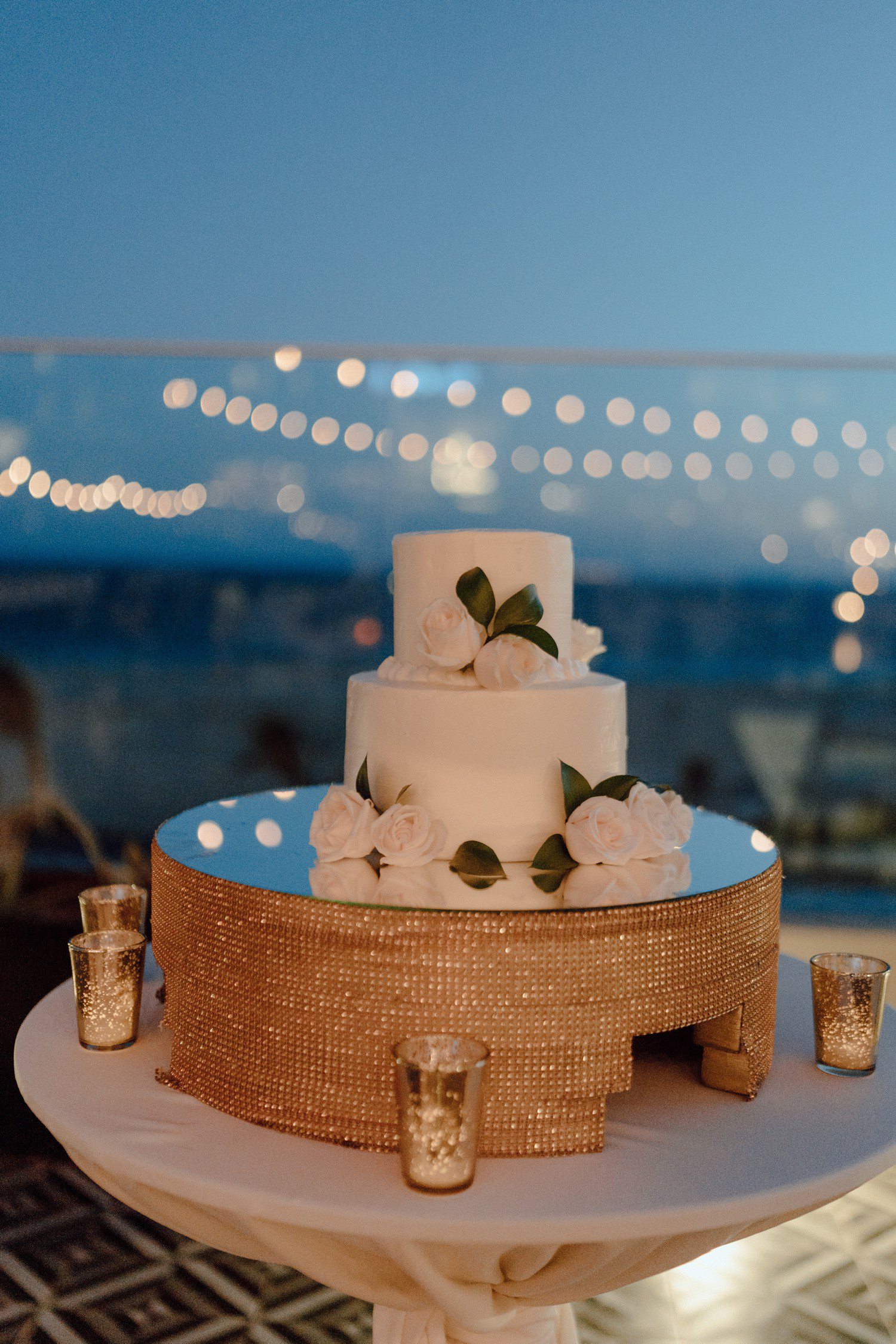 White wedding cake with decorative flowers. 