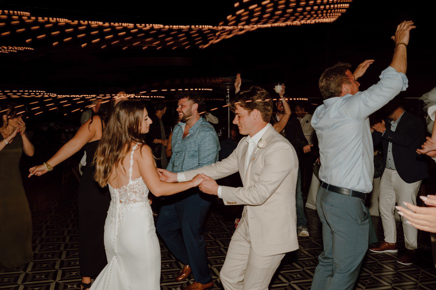 Bride and groom dancing together during reception at in Los Cabos. 