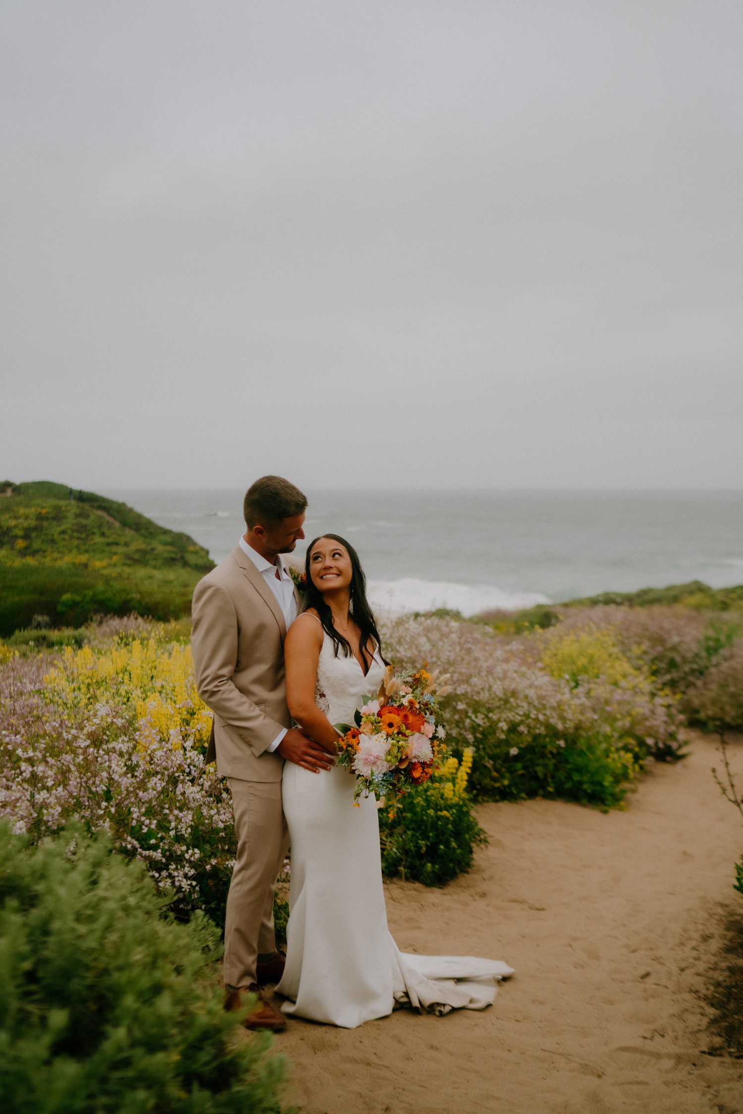 Big Sur beach elopement photos with wildflowers. 