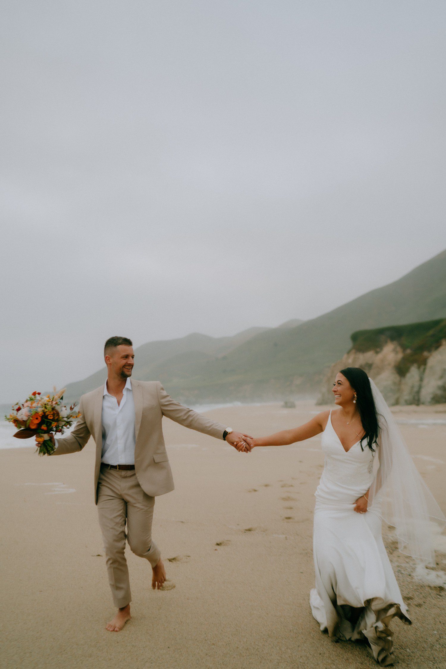 Wedding couple on Garrapata Beach Big Sur. 