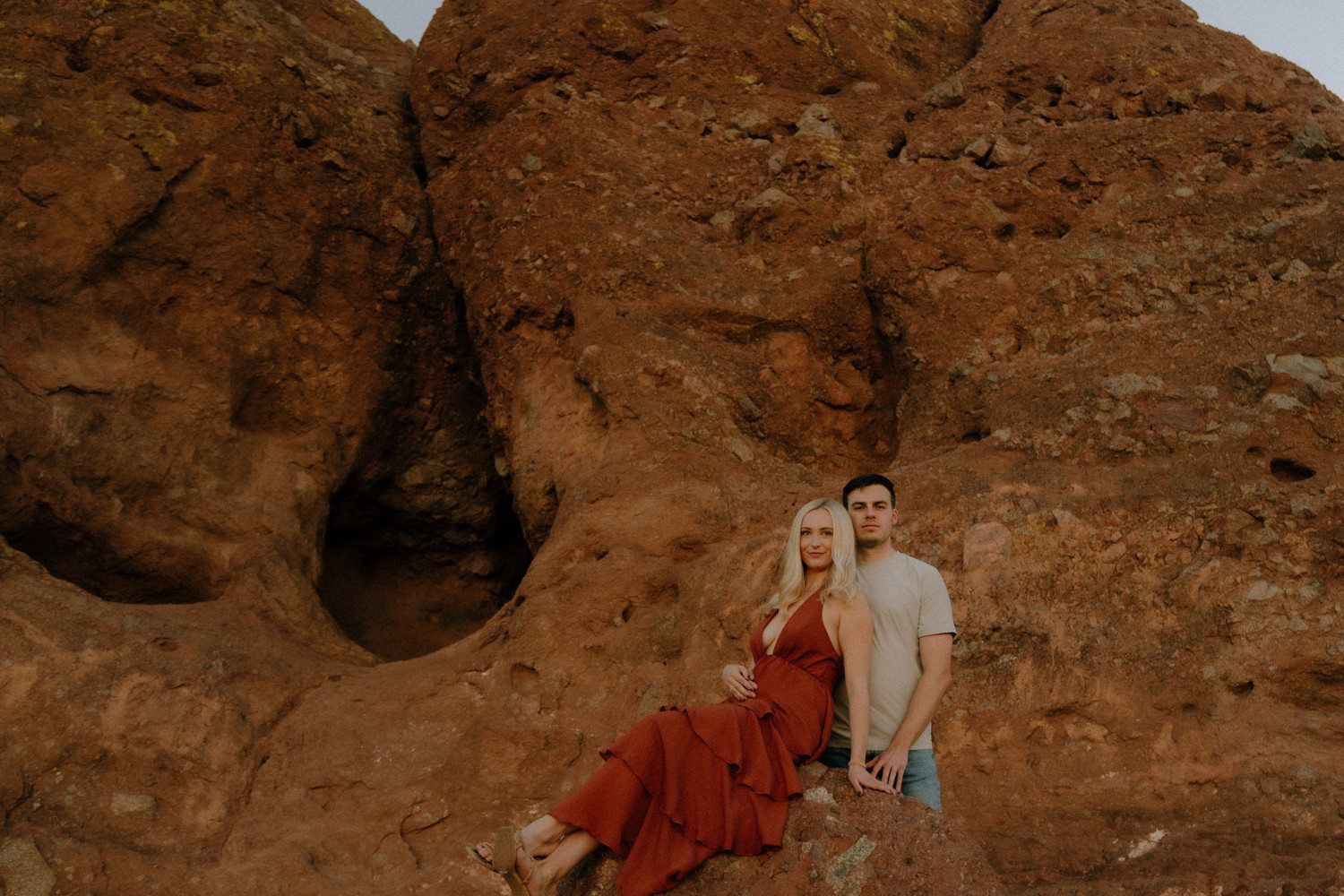Couple at Papago Park taking photos on rock formations. 