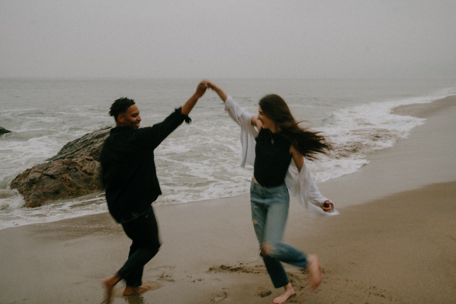 Beach engagement photos at Point Dume in California. 