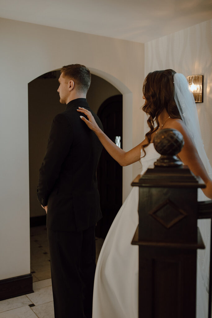 bride and groom at their first look before their wedding ceremony