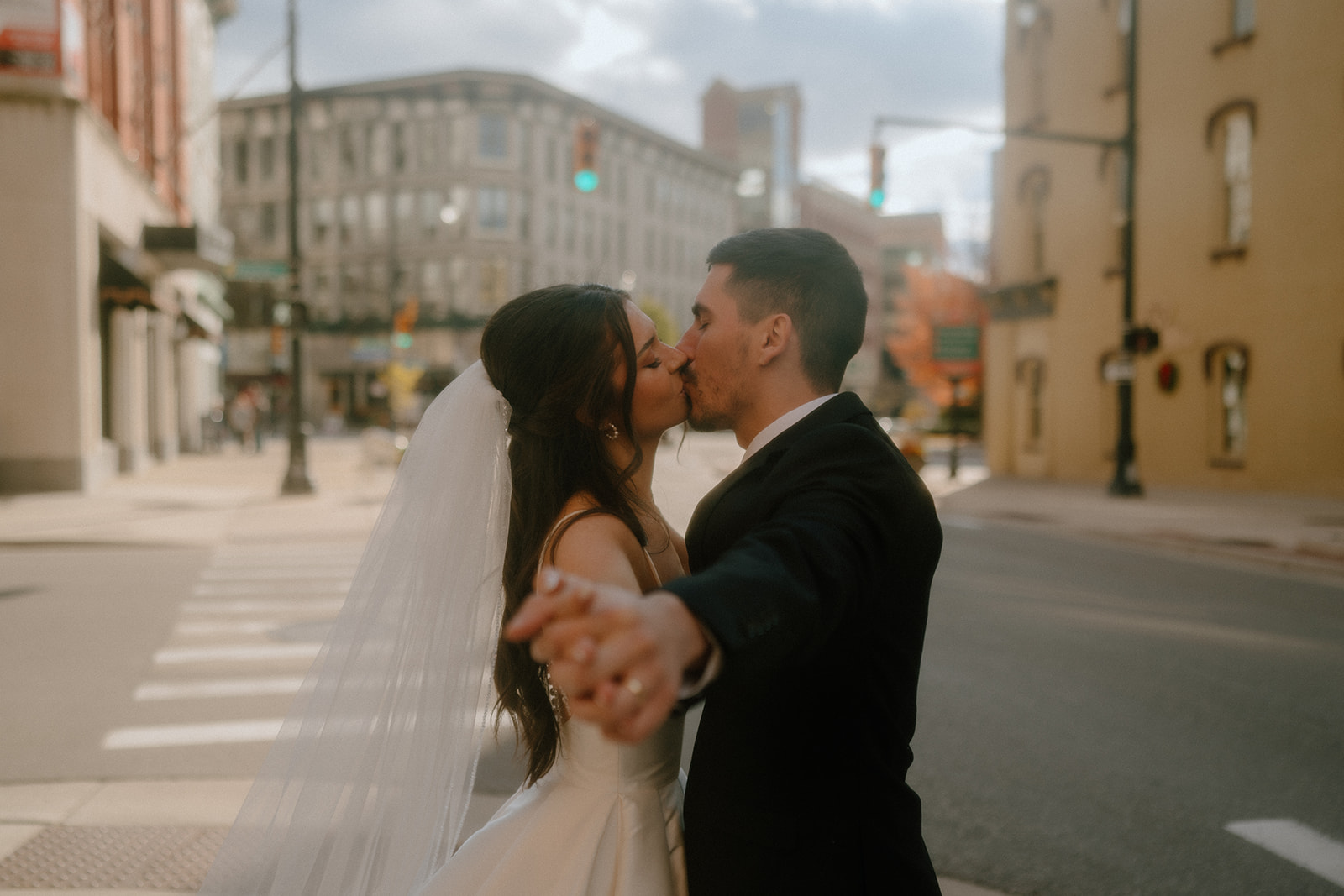 stunning newly eloped couple kissing during their photoshoot