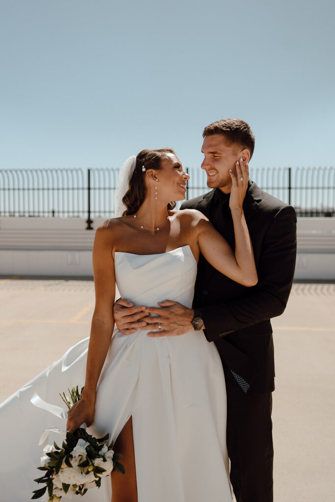 cute bride and groom looking at each other