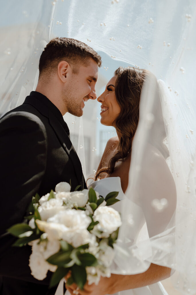 bride and groom looking at each other