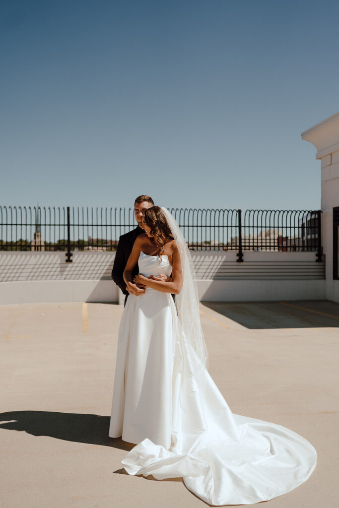 bride and groom hugging