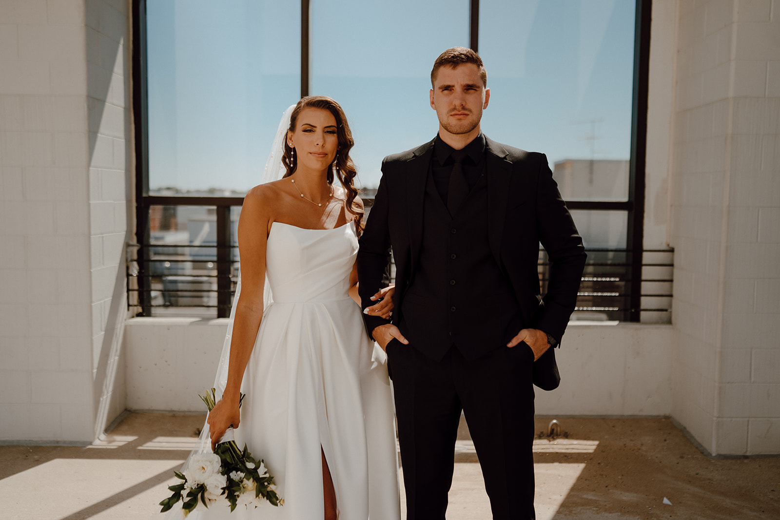 bride and groom looking at the camera during their intimate wedding