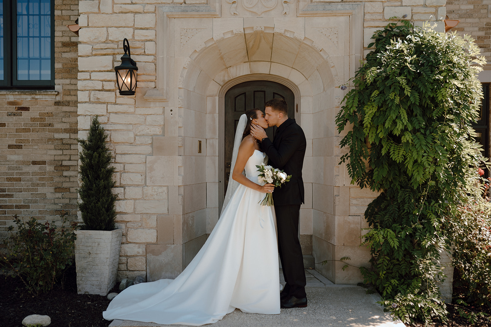 bride and groom kissing before their wedding ceremony