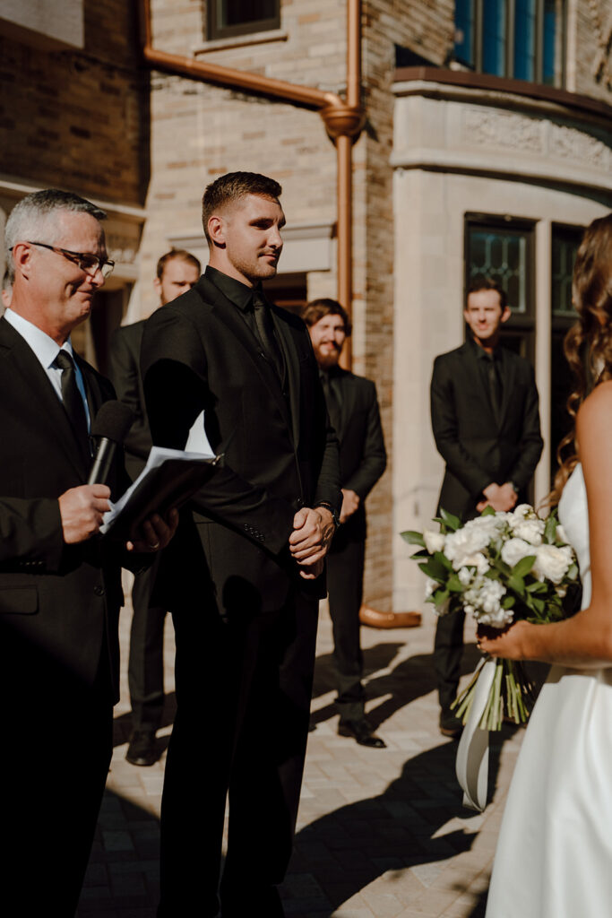 groom waiting for the bride at the altar