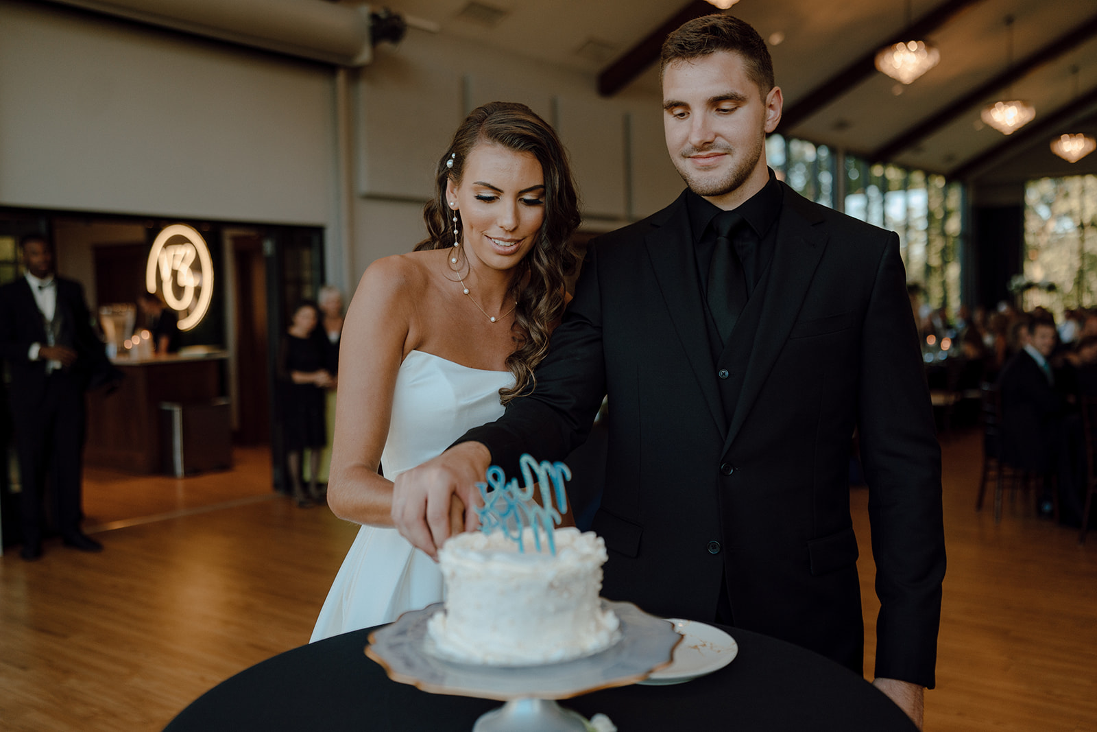 bride and groom cutting their wedding cake