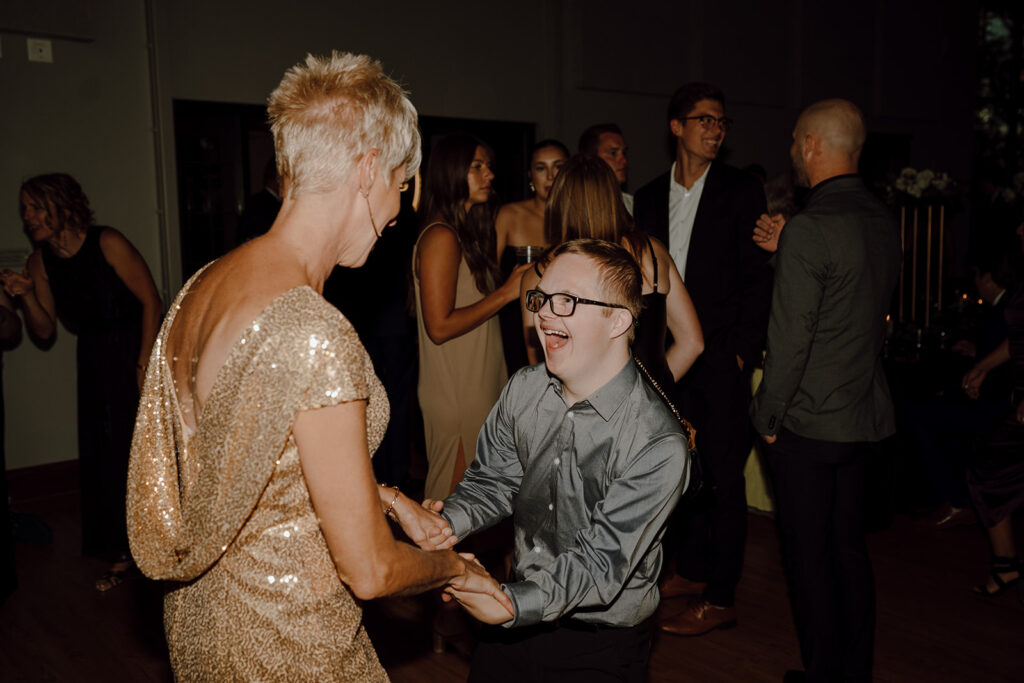 wedding guests dancing at the wedding reception