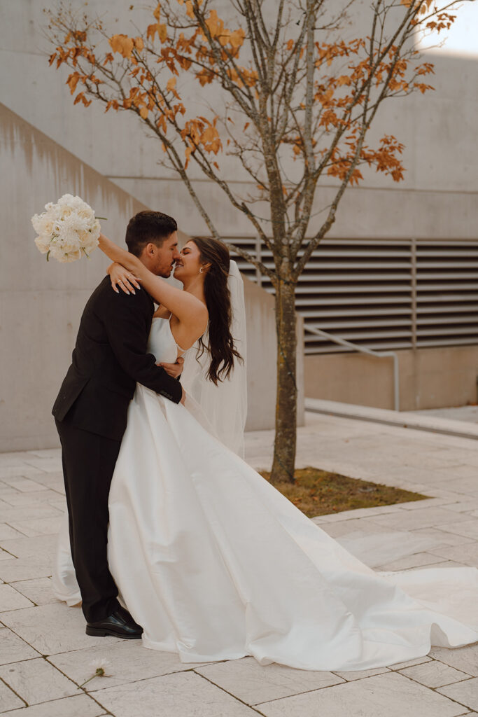 cute bride and groom kissing