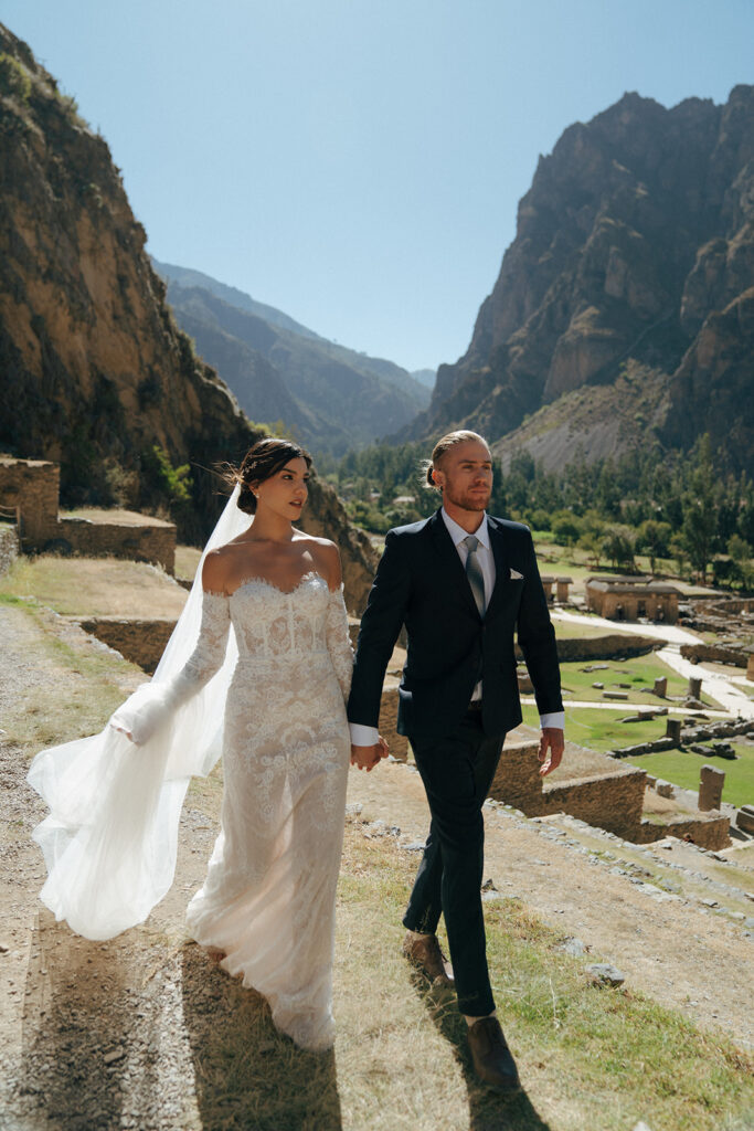 bride and groom holding hands walking around during their session