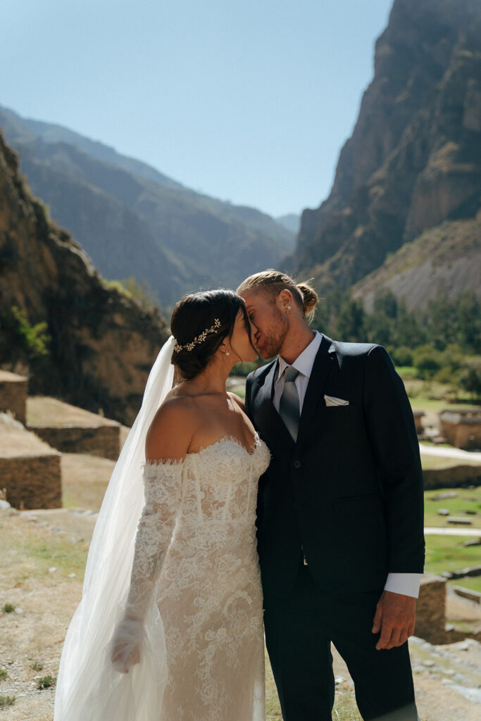 bride and groom kissing during their photoshoot