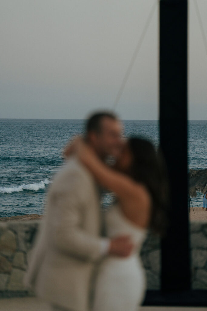 bride and groom hugging at their wedding reception