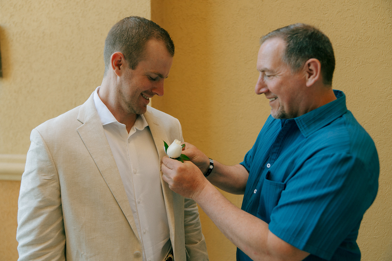 groom and his dad before the wedding ceremony