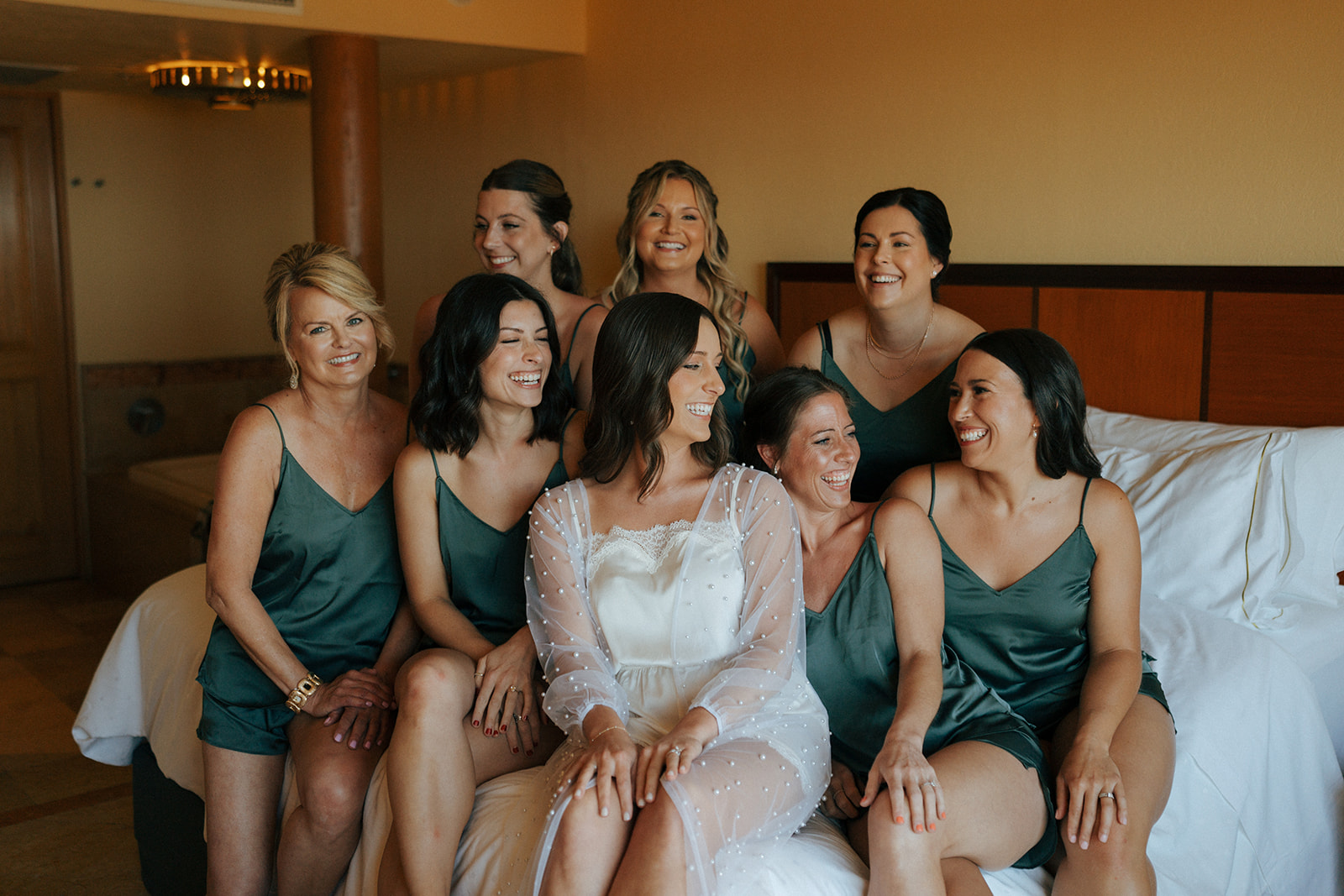 bride and her friends before getting ready for her timeless summer wedding ceremony