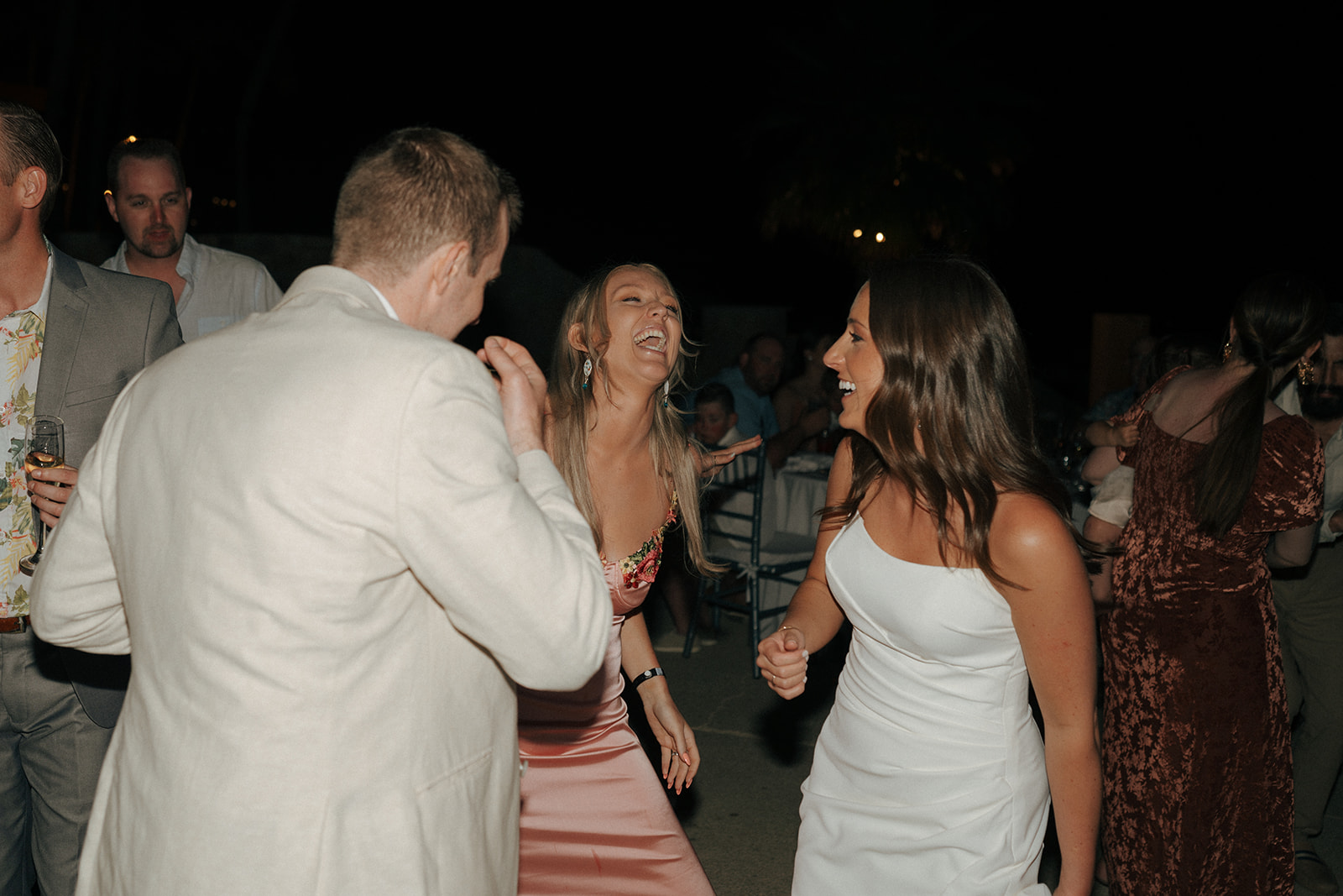 bride and groom dancing with their wedding guests