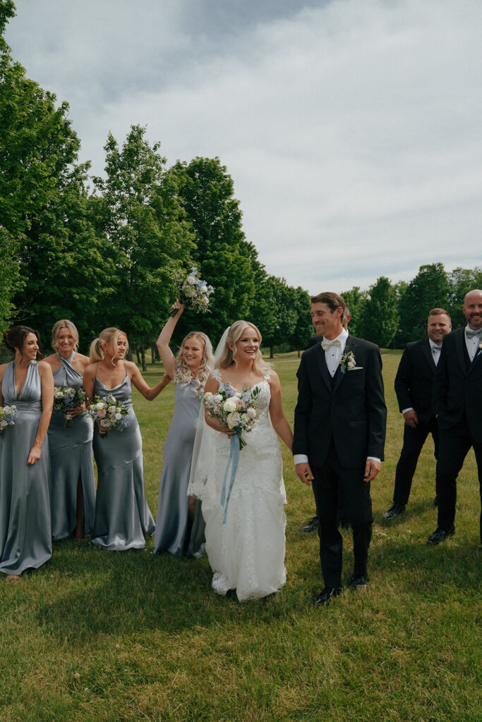 bride and groom heading to their colorful wedding ceremony