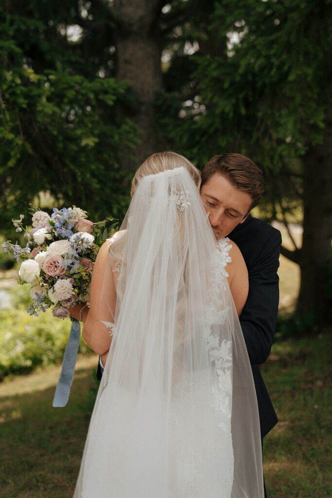 bride and groom hugging before their wedding ceremony