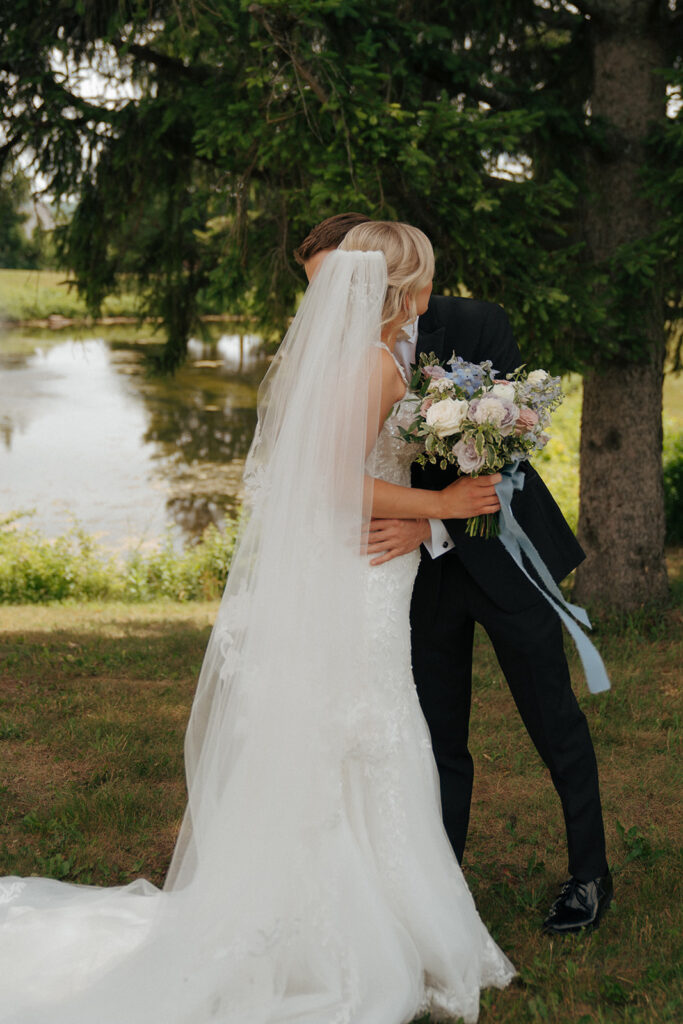 bride and groom hugging