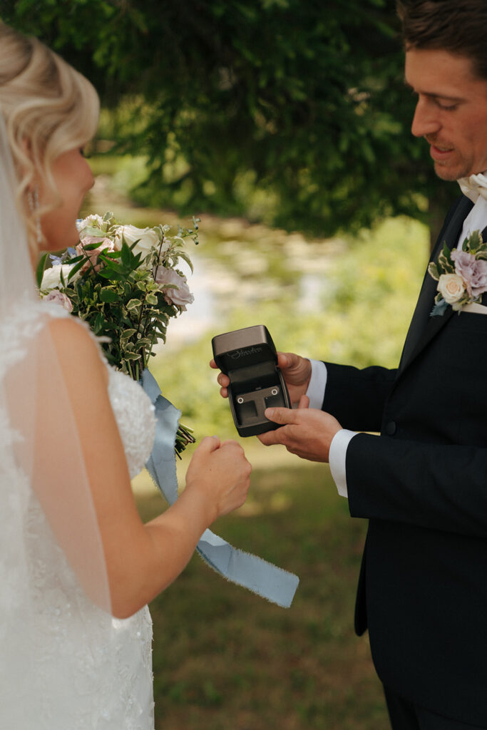 groom giving the bride a wedding present