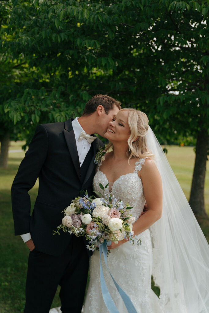 groom kissing the bride