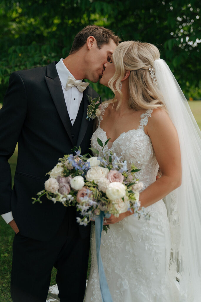 bride and groom kissing at their colorful wedding day